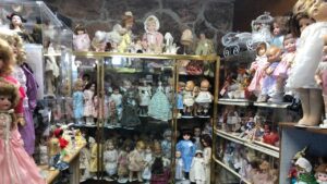 Dolls line the shelves of Mrs. B's Dolls
