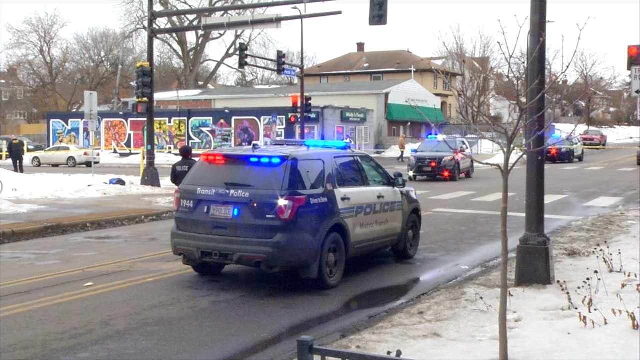 shooting scene with minneapolis police squad cars