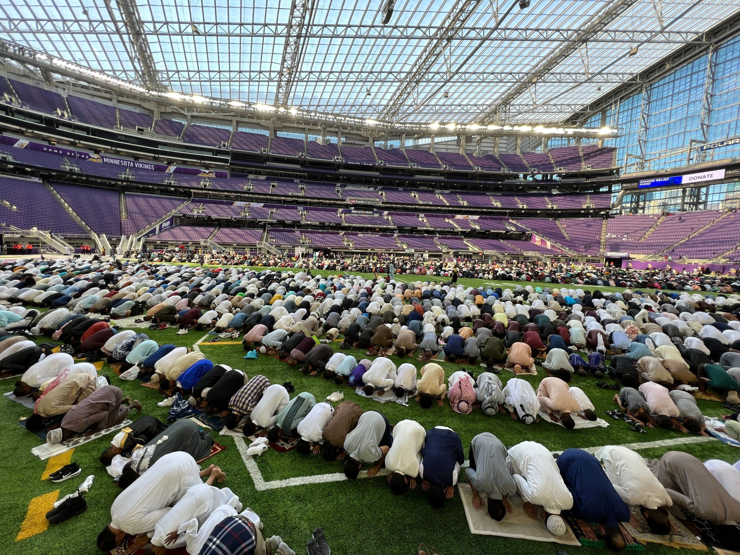 Thousands of Muslims gather to pray inside U.S. Bank Stadium