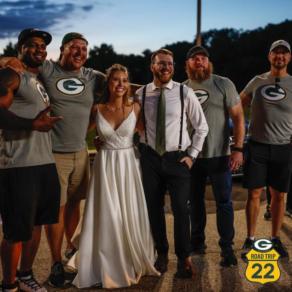 Former packers players take photo with wedding guests in La Cross Wisconsin. 