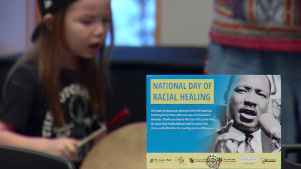 A child bangs on a drum during a musical performance as part of the National Day of Racial Healing event Monday, Jan. 16, 2023, at the Westwood Hills Nature Center in St. Louis Park.