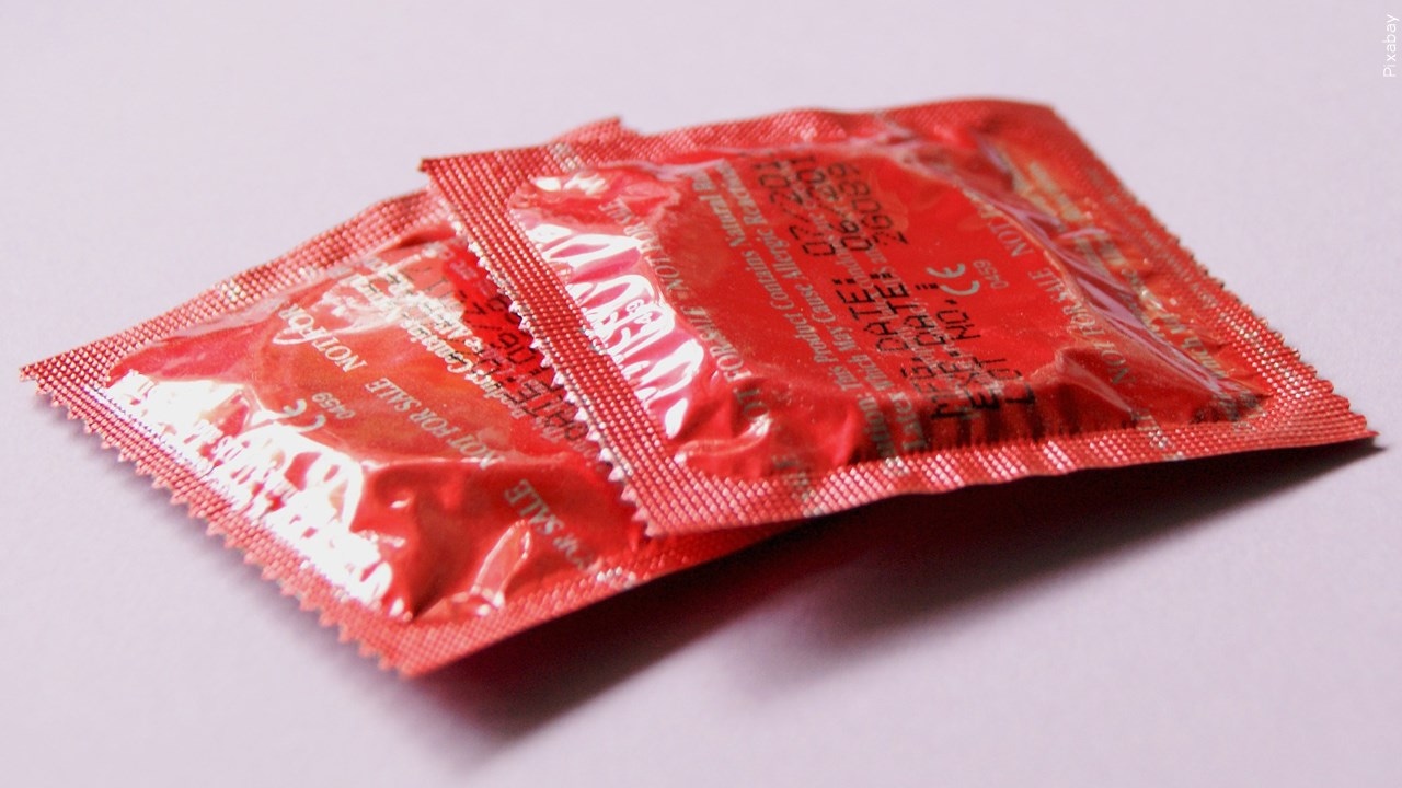 two condoms in wrappers