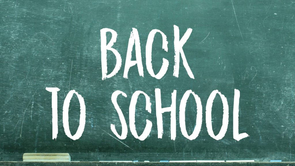 back to school graphic with chalk font on blackboard