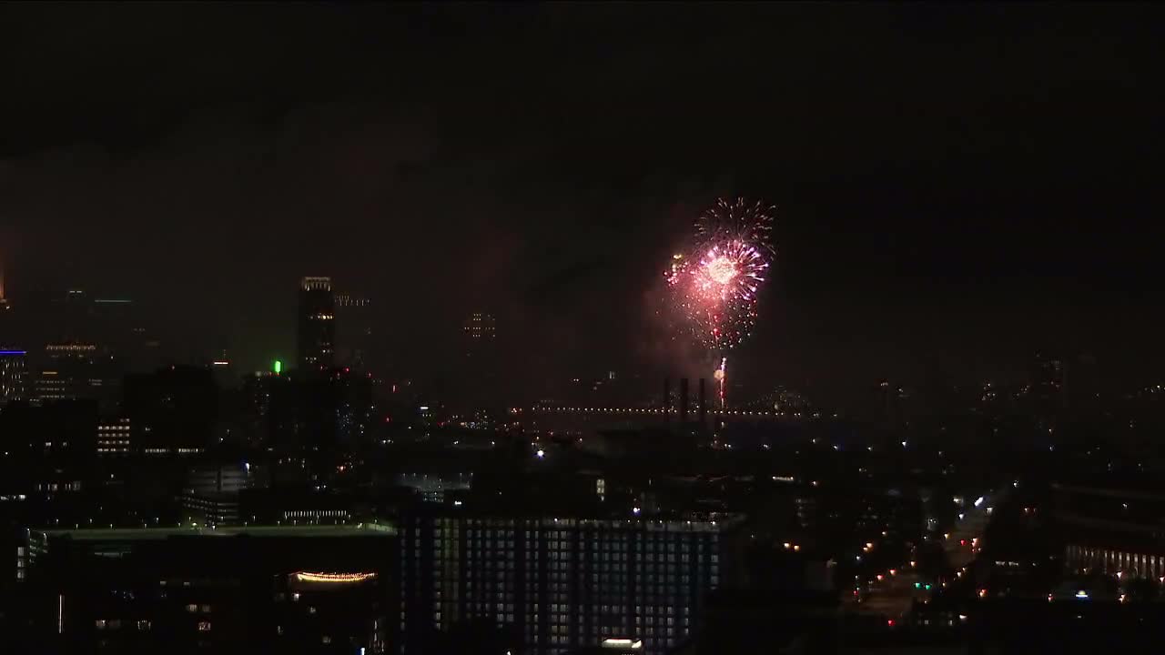 Fireworks proceed in Minneapolis after daytime rain showers clear out