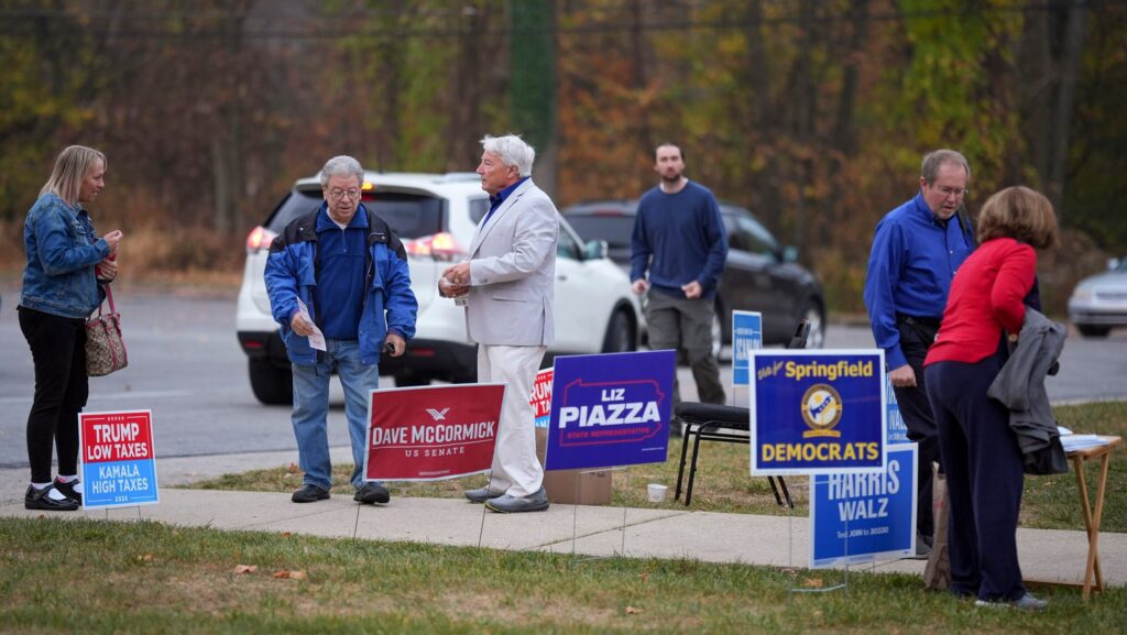 The Latest Polls begin to close in some counties as Americans cast